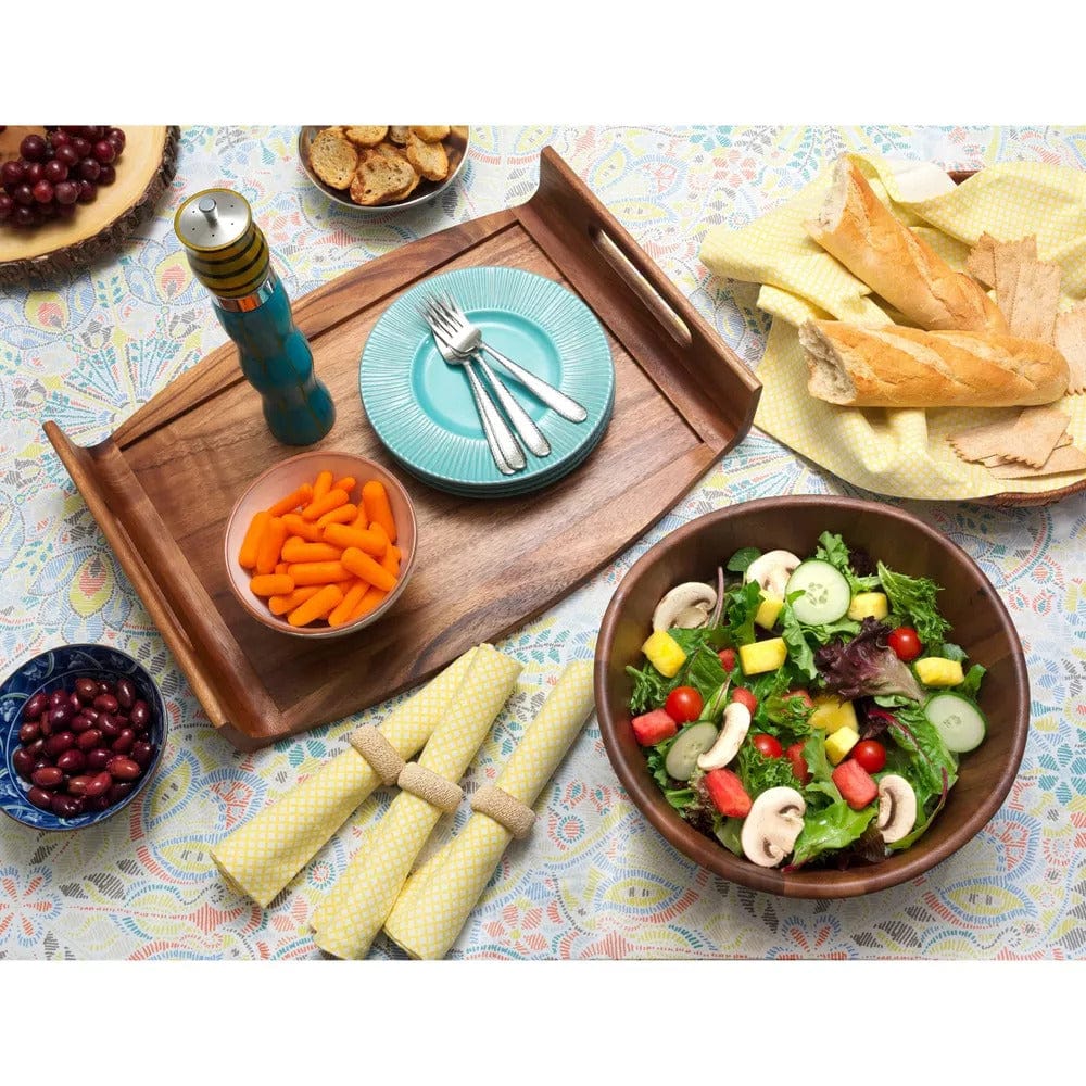Reversible acacia serving or bed tray with handles showcasing food items plates and napkins