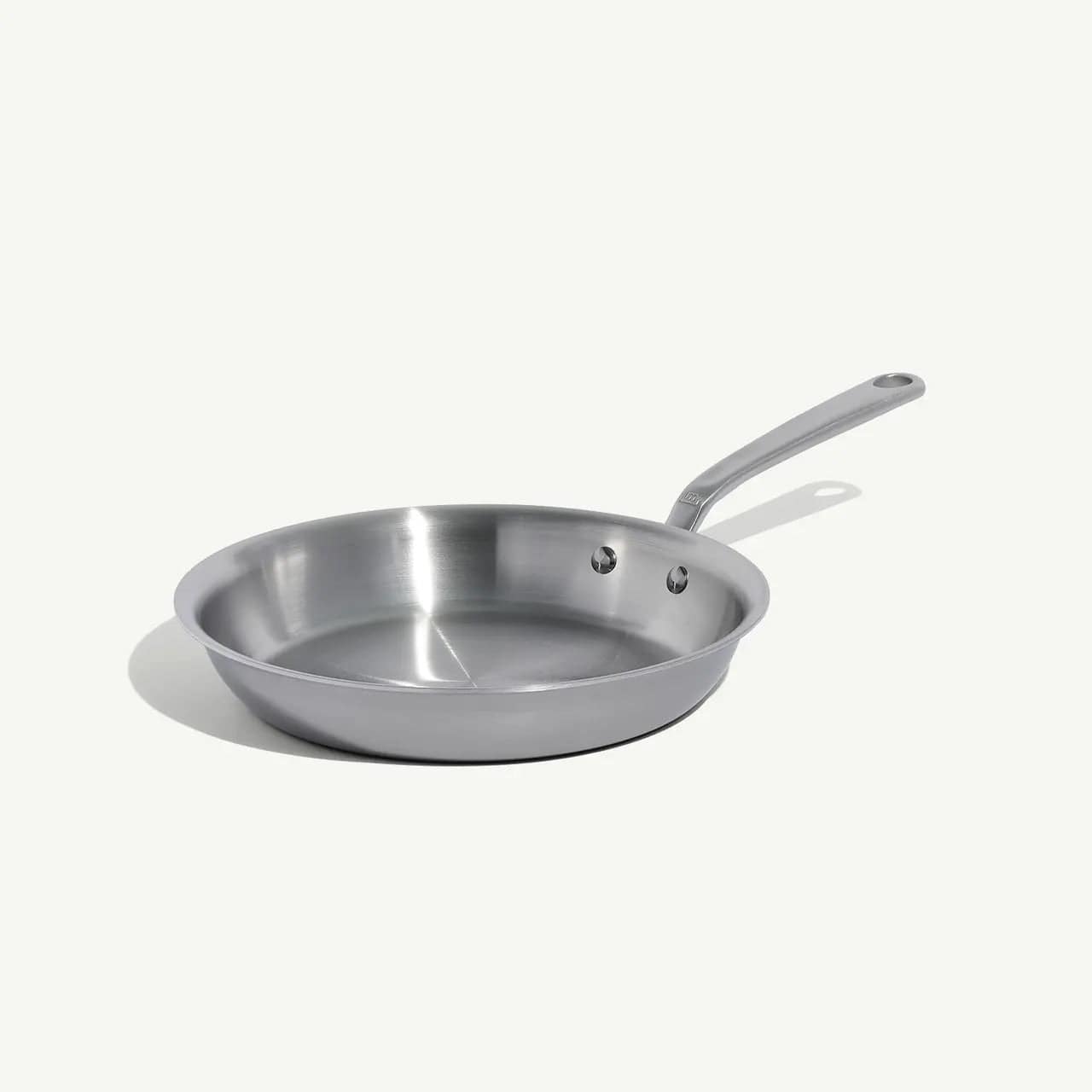 10 stainless clad frying pan with a polished finish and a long slender handle