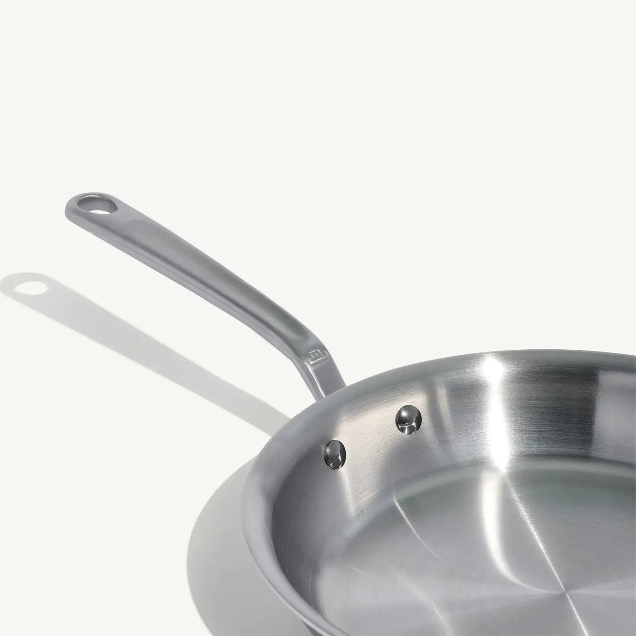 10 stainless clad frying pan with a long silver handle