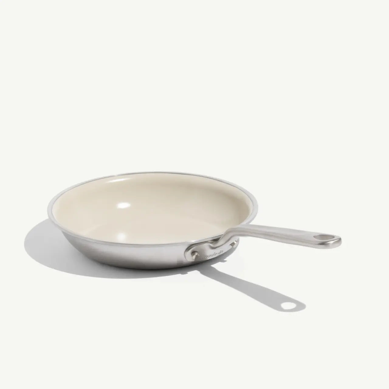8 CeramiClad frying pan with a cream-colored non-stick interior and a brushed stainless steel exterior and handle