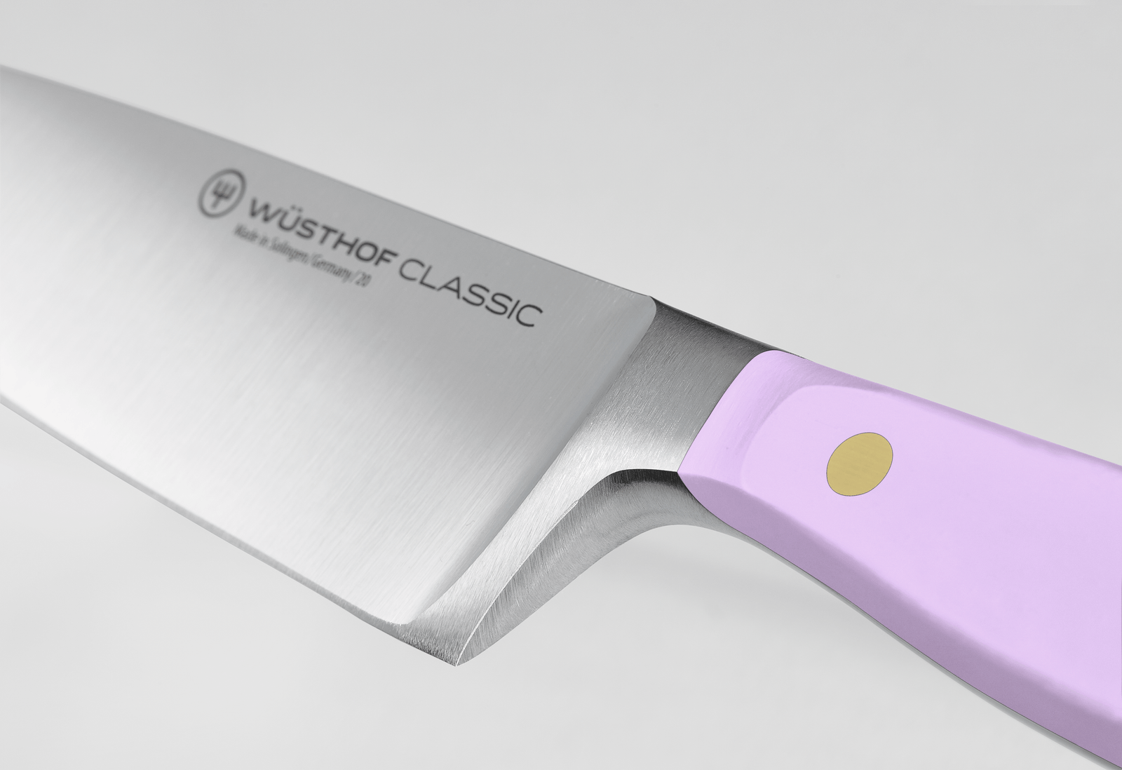 Wusthof Classic 8 Chefs Knife with a silver blade and a lavender handle featuring a gold rivet