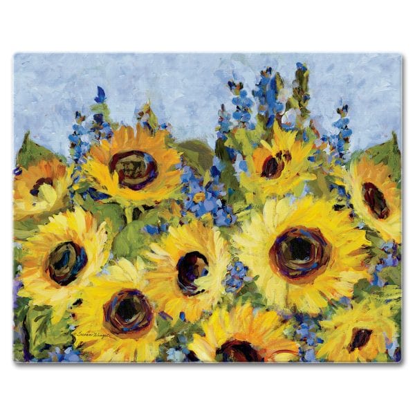 Glass cutting board with an impressionist painting of bright yellow sunflowers and blue flowers under a light blue sky