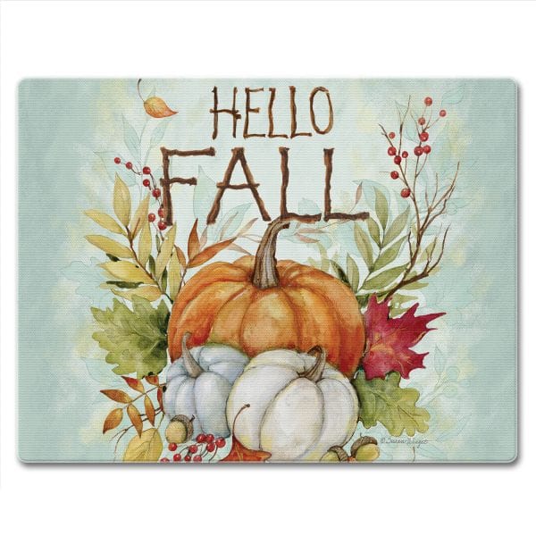Glass cutting board with HELLO FALL text pumpkins fall leaves and berries on a light blue background