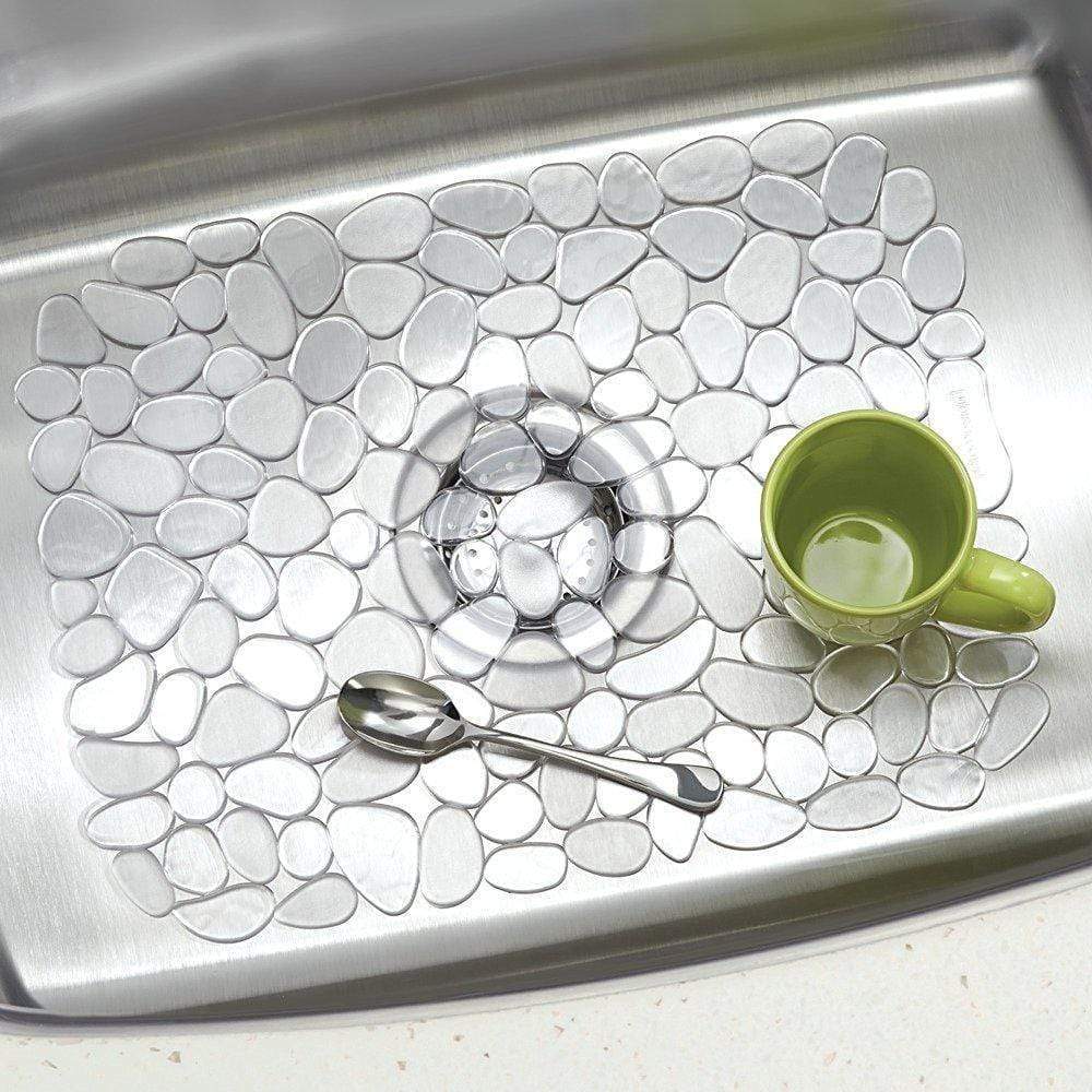 Clear Pebblz sink mat with pebble design protecting a stainless steel sink